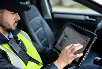 Police-officer-using-a-tablet-in-car_339x229